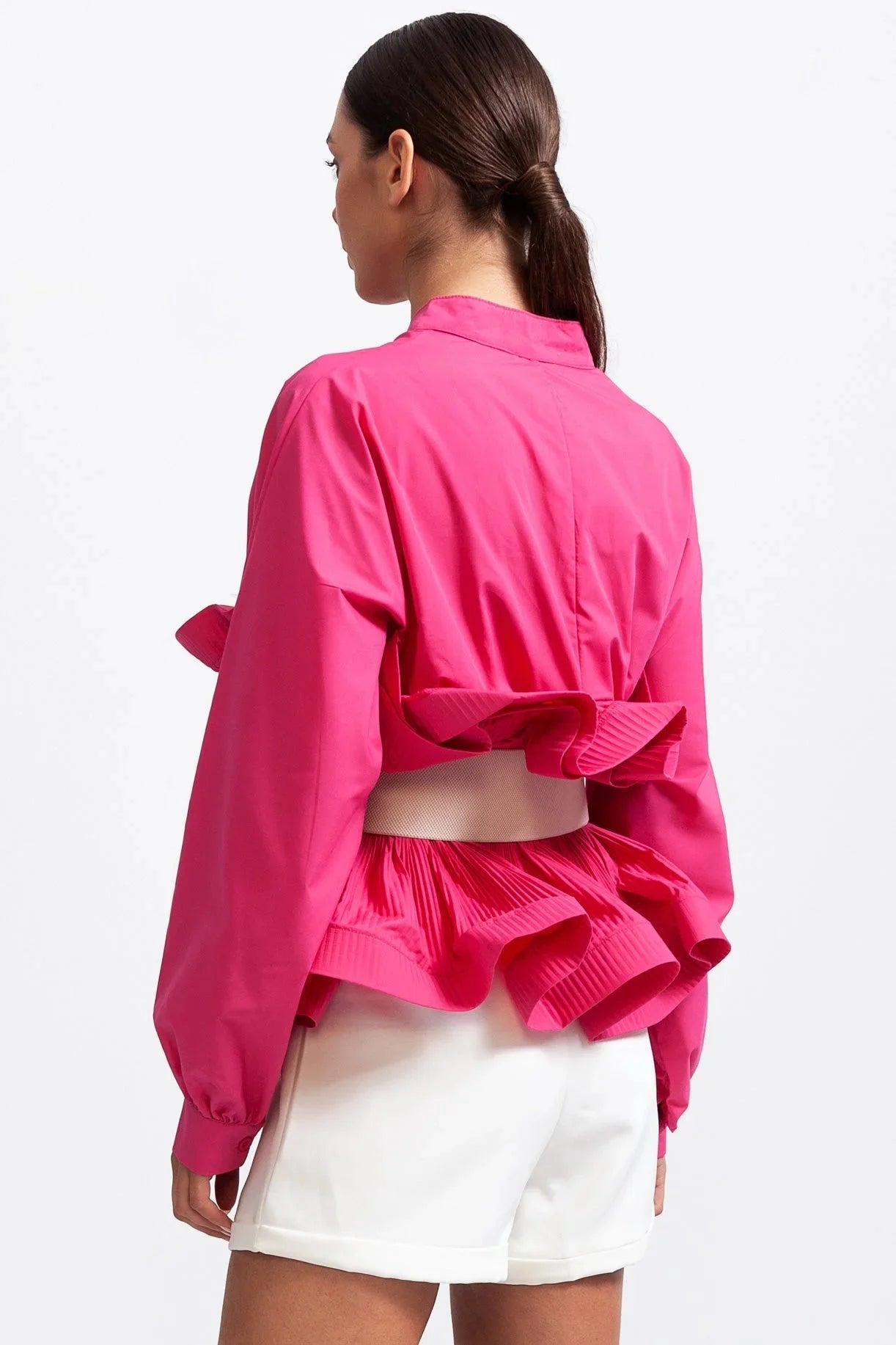 Blouse rose pour femme avec volants et manches volumineuses, en coton léger.
