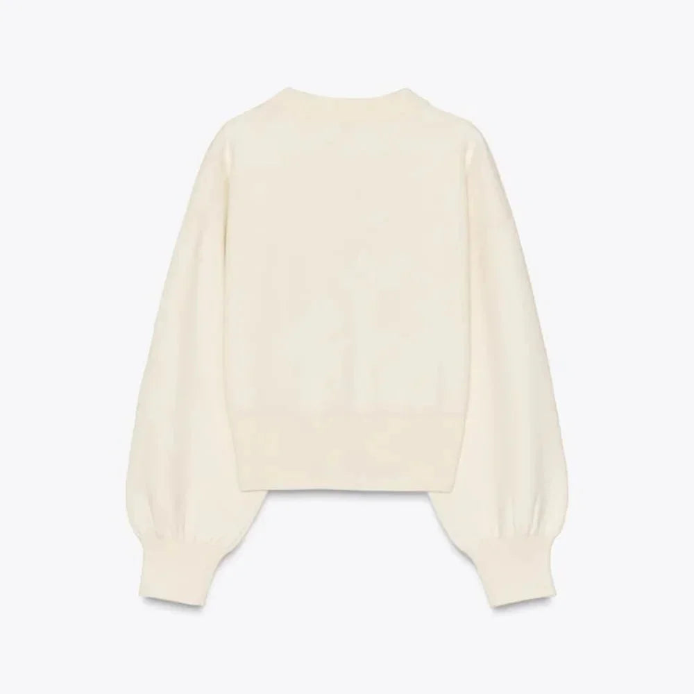 Cardigan crème à manches longues, boutons stylés, en matière douce, coupe classique pour femme.