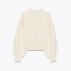 Langärmeliger, cremefarbener Cardigan aus weichem Material mit stilvollen Knöpfen und elegantem Design für Damen.