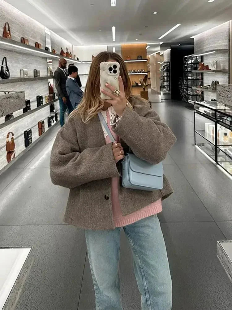 Beige Cardigan für Damen aus anschmiegsamem Material, mit Knöpfen und lässigem Schnitt für täglichen Komfort.