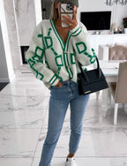 Cardigan blanc à motifs géométriques pour femme, avec boutons, en matière légère, adapté aux tenues décontractées.