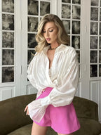 Chemisier femme rose à col classique, manches évasées, en mélange de coton léger, coupe moderne.