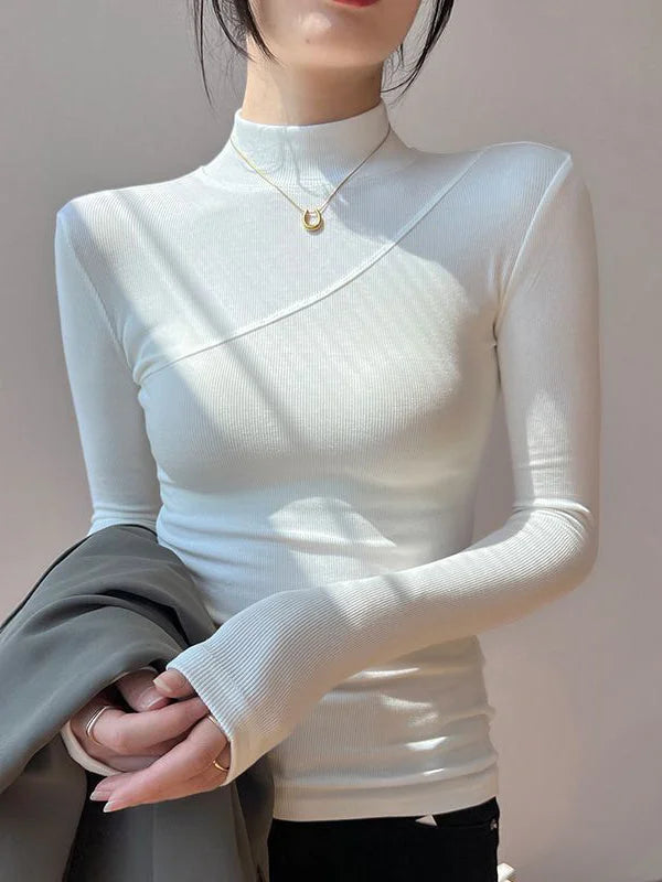 Haut femme blanc col montant, manches longues, en tissu extensible pour un confort optimal.