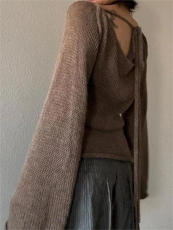 Haut femme noir en tricot, dos ouvert, manches évasées, en matière douce et respirante.