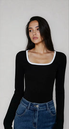 Haut femme noire à encolure carrée, avec bordures contrastées, en tissu doux et respirant.