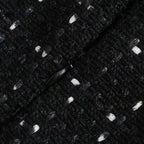 Mini robe noire perlée avec découpes, manches épaules nues, tissu léger et détails en perles pour un look élégant.