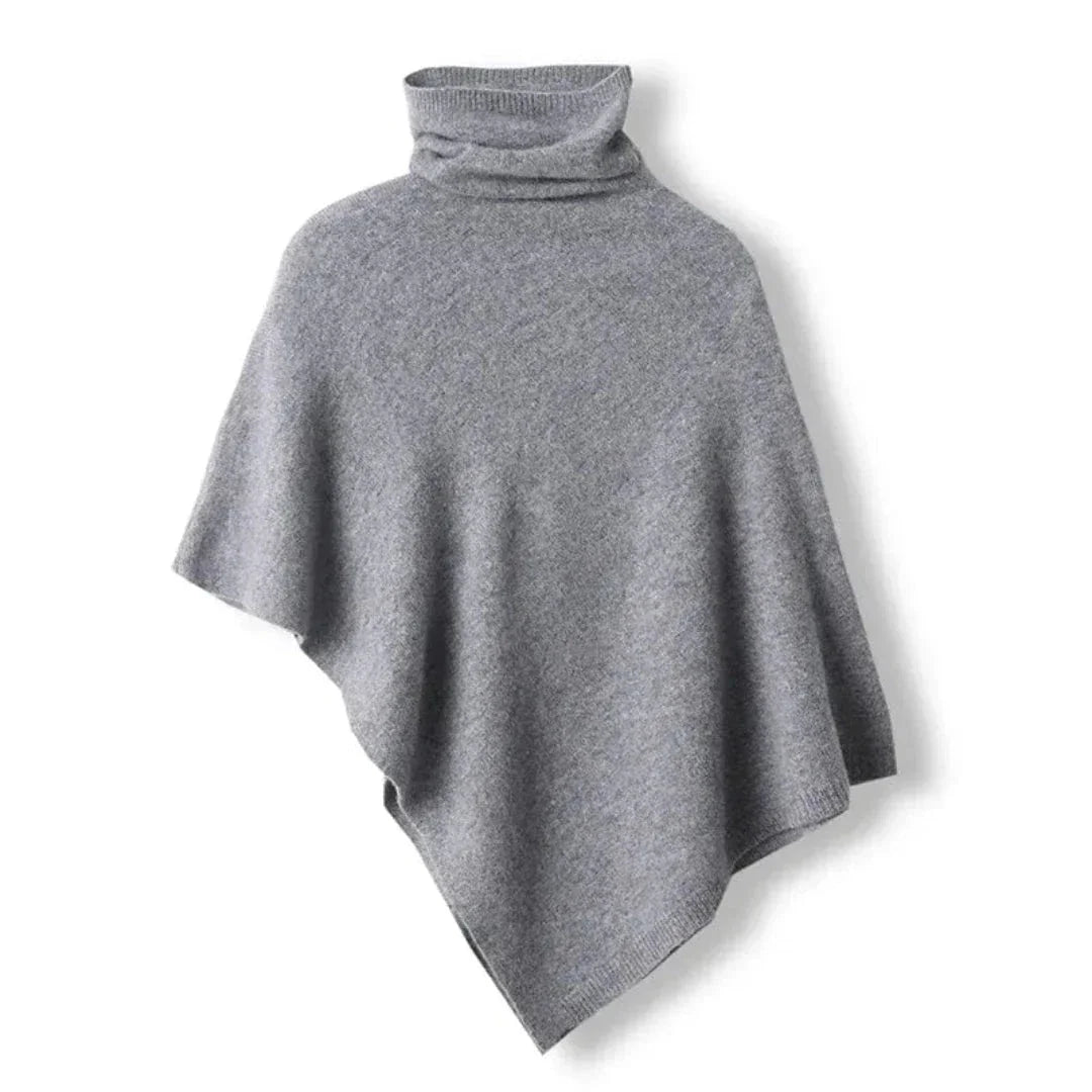 Poncho pour femmes en rouge foncé, en tissu doux, avec coupe asymétrique et motif distinctif.