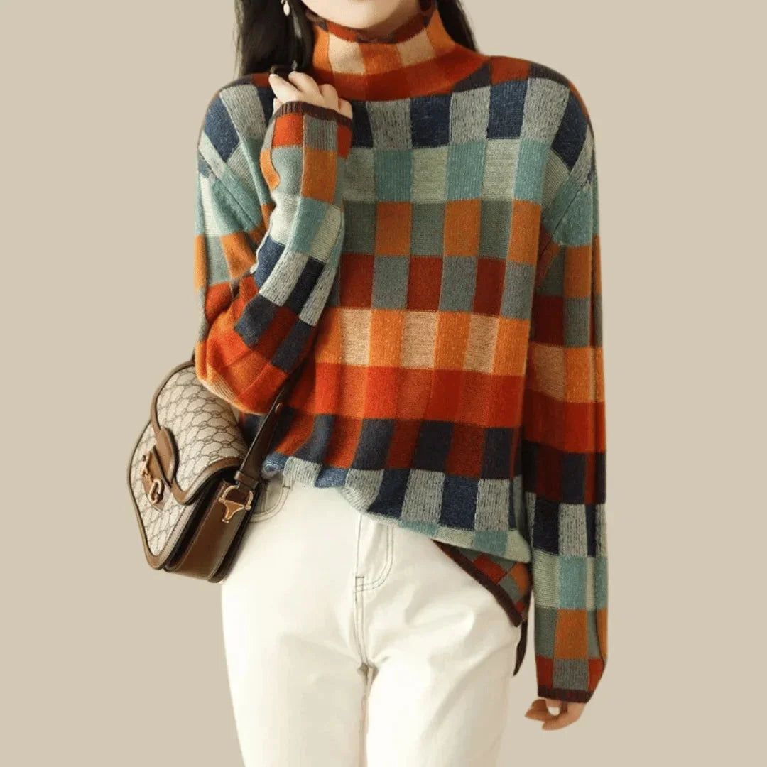 Multicolour patchwork women's turtleneck sweater made of soft knitted fabric, featuring a unique design and warm feel.