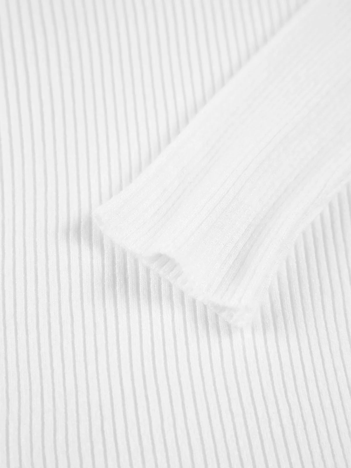 Ivory ribbed women's sweater with a high collar, made from soft, breathable fabric for comfort and warmth.