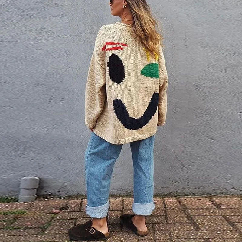 Pull femme oversize bleu avec motif smiley, manches longues, en mélange de coton.