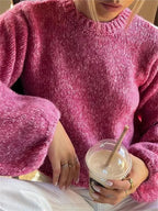 Rosa Damenpulli aus weichem Material mit modernem, offenem Rücken für einen stylishen Look und besonderen Tragekomfort.