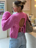 Rosa Damenpullover mit modernem, offenem Rücken aus weichem, atmungsaktivem Material für vielseitige Looks.