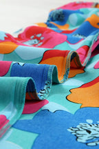 Robe courte à fleurs, col V, manches 3/4, en coton léger, idéale pour l'été et les vacances à la plage.