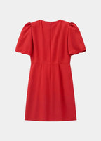 Robe courte à pois avec nœuds et manches bouffantes, en tissu léger, parfaite pour des soirées décontractées.