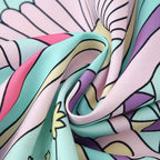 Robe courte sans manches en tissu léger, imprimé sirène pastel, idéale pour l'été à la plage ou en vacances.