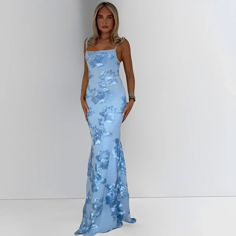 Robe longue femme en coton léger, motifs floraux, bretelles fines et décolleté doux, idéale pour les journées ensoleillées.