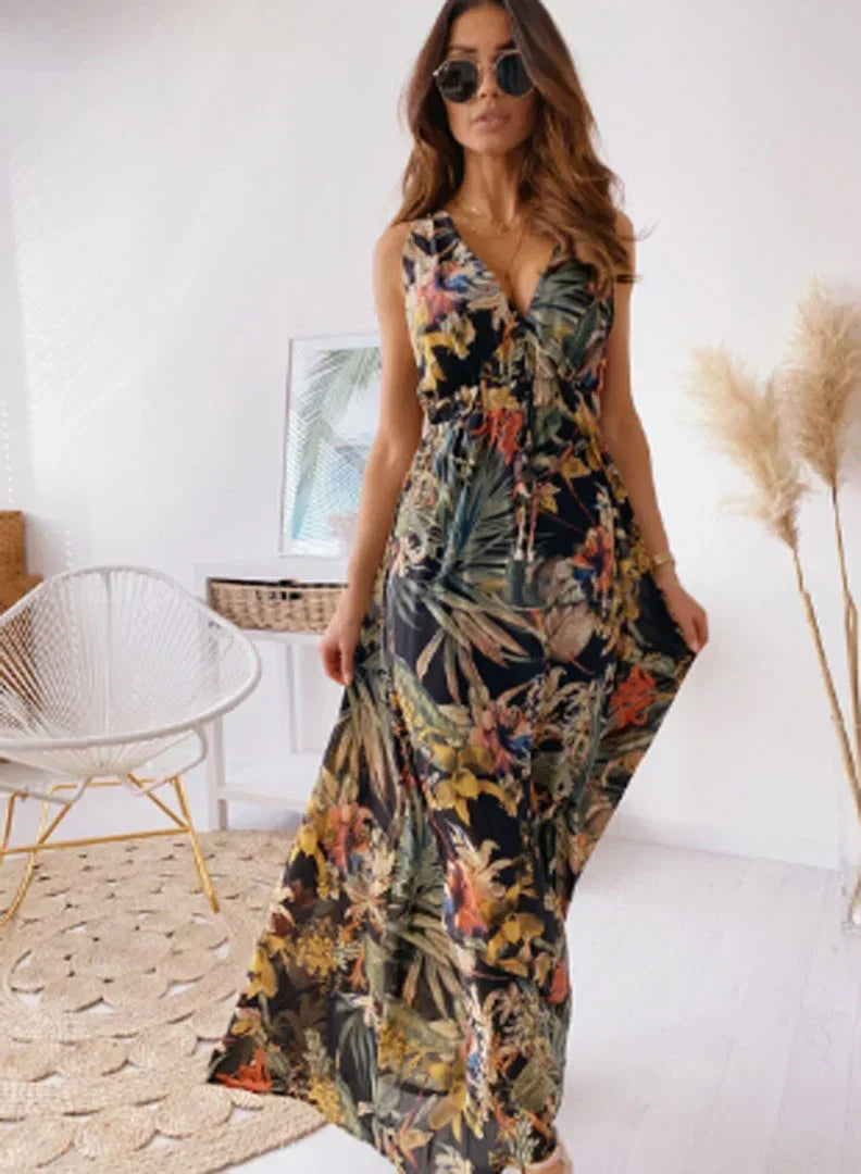 Robe longue sans manches en tissu léger, col en V, avec un imprimé floral coloré, idéale pour l'été décontracté.