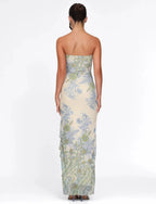 Robe longue sans bretelles en coton avec motif floral et fente élégante, idéale pour les journées d'été.