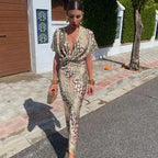 Robe longue verte à imprimé floral, col en V, ajustable avec ceinture, idéale pour des soirées d'été.