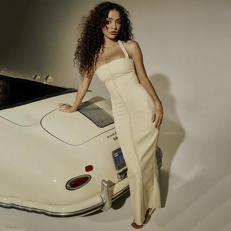 Robe longue ajustée sans manches en coton stretch, avec fermeture zippée au dos et coupe flatteuse pour un confort optimal.