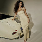 Robe longue ajustée sans manches en coton stretch, avec fermeture zippée au dos et coupe flatteuse pour un confort optimal.