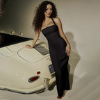 Robe longue ajustée sans manches en jersey, avec fermeture zippée et poches latérales pour un style décontracté.