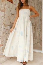 Robe longue à bretelles, imprimée en blanc, avec une encolure carrée, parfaite pour les journées d'été. Material léger et…