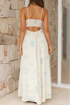 Robe longue à bretelles, imprimée blanche avec encolure carrée, légère et fluide, idéale pour l'été.