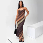 Robe longue femme en tissu fluide, bretelles fines, avec un dégradé de couleurs ombrées pour une allure élégante.