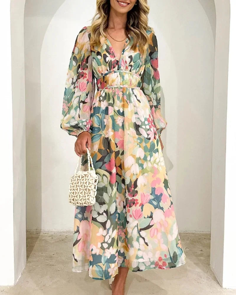 Robe longue fleurie pastel avec manches longues, col en V, en tissu léger, parfaite pour le printemps et l'été.