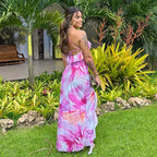 Robe longue fleurie rose sans manches avec volants, en coton léger, idéale pour les journées d'été.