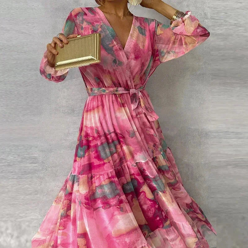 Robe longue longue rose imprimée avec manches longues, ceinture évasée, idéale pour les soirées d'été.