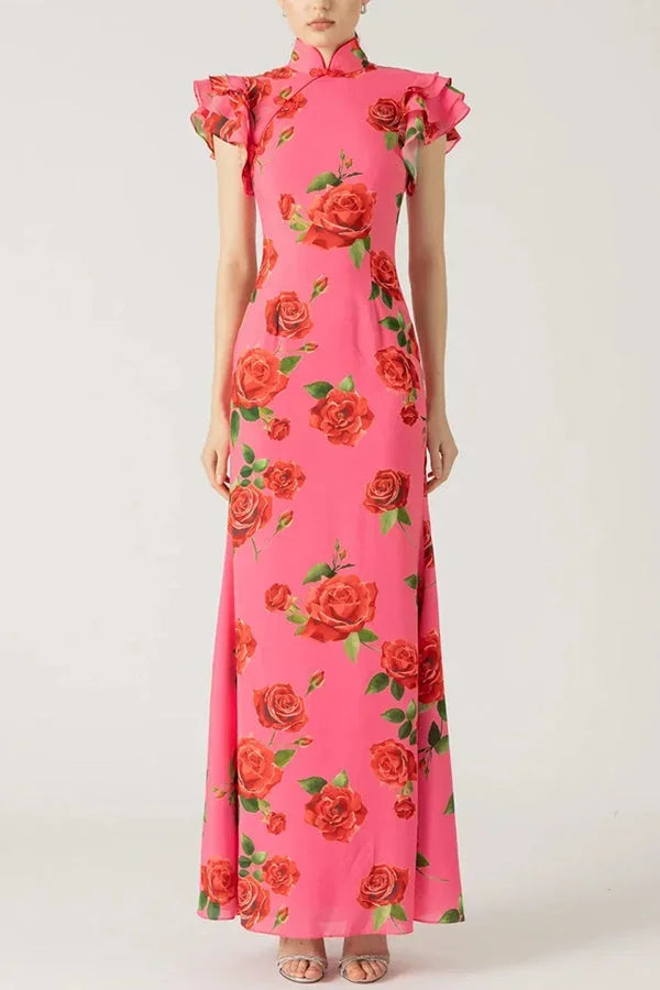 Robe longue rose avec motifs floraux, manches volantées, col haut en tissu léger et fluide, parfaite pour les journées…