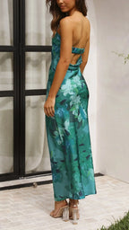 Robe longue sans bretelles en coton léger avec un motif floral, idéale pour l'été, offrant confort et élégance décontractée.