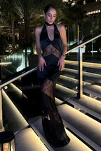 Robe longue sans manches en dentelle, avec un dos nu élégant et une coupe fluide pour les soirées.