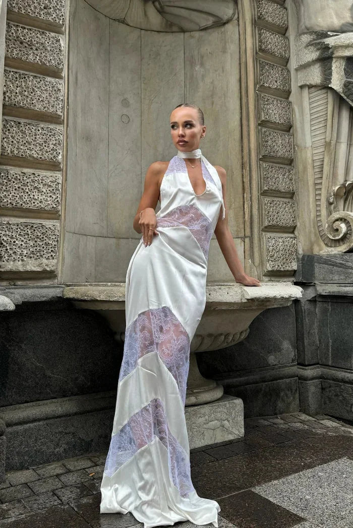 Robe longue sans manches en dentelle avec dos nu, idéale pour les soirées. Matière légère et transparente pour un style…