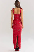 Robe longue en dentelle sans manches avec nœuds, élégante et légère, idéale pour des occasions estivales.