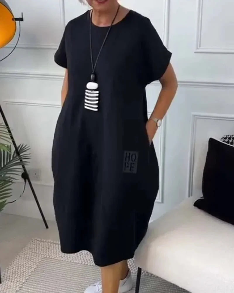 Robe midi ample en tissu fluide, manches courtes, décontractée avec poches, idéale pour un usage quotidien toutes…