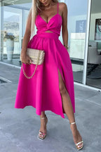 Robe midi en coton avec découpes, poches latérales et fente longue, idéale pour un look décontracté.