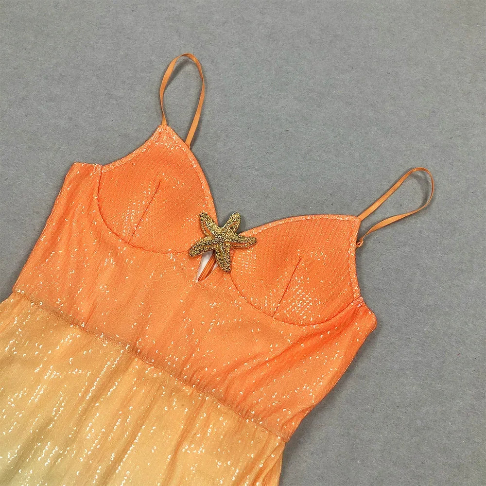 Robe midi sans manches dégradée orange et bleue, en coton léger, ornée d'une étoile de mer brodée pour une touche estivale.