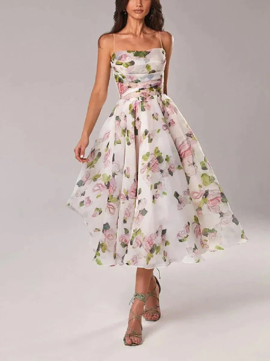 Robe midi sans manches en matière légère avec imprimé floral coloré, col droit, idéale pour les événements printaniers et…
