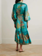 Robe midi fluide imprimée, ceinture incluse, manches longues, col à revers, idéale pour l'automne. Matériau léger et…