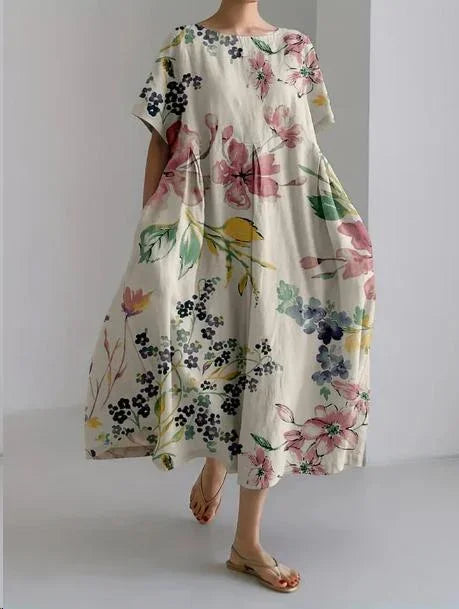 Robe midi légère à imprimé floral, coupe ample, manches courtes, idéale pour le printemps et confectionnée en tissu doux.