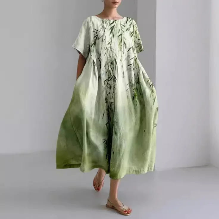 Robe midi décontractée à imprimé floral, coupe ample, manches courtes, en tissu léger idéale pour le printemps.