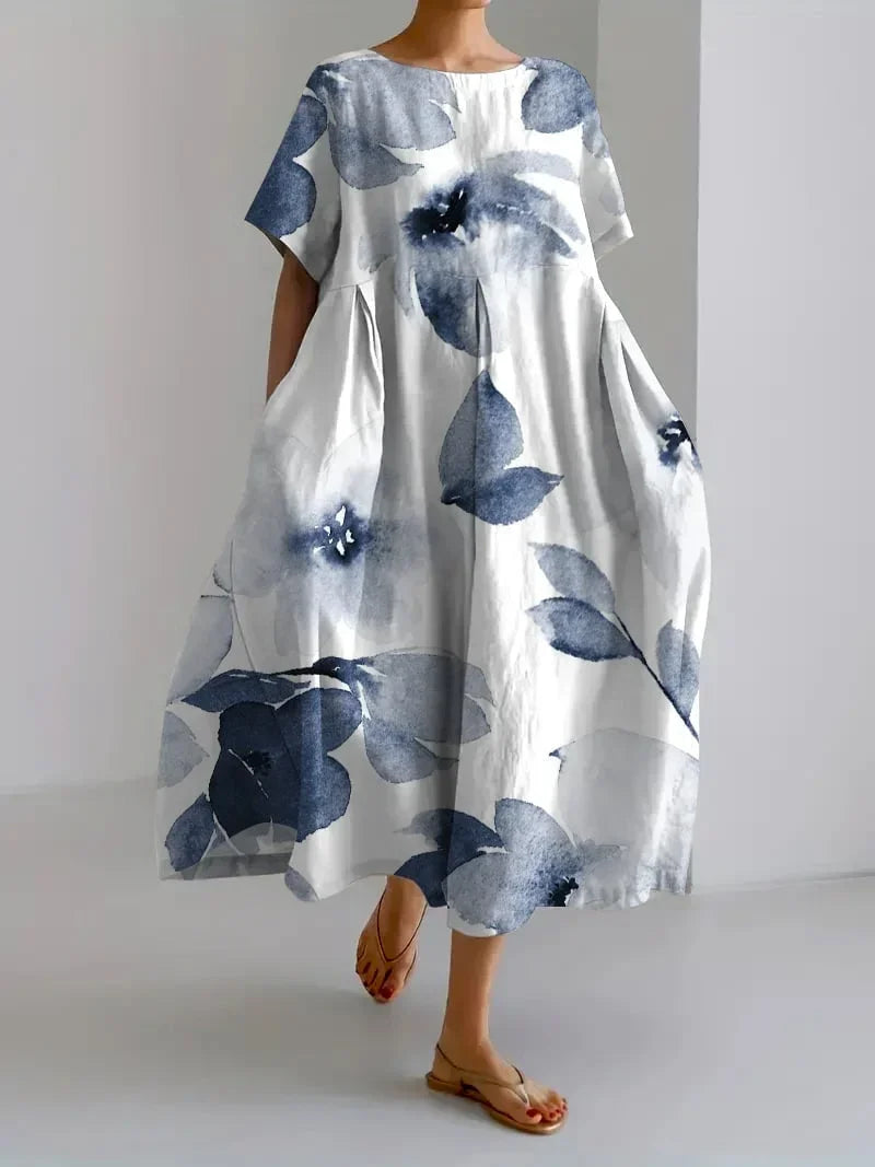 Robe midi à imprimé floral, coupe ample, manches courtes, en coton léger, idéale pour le printemps et les journées…