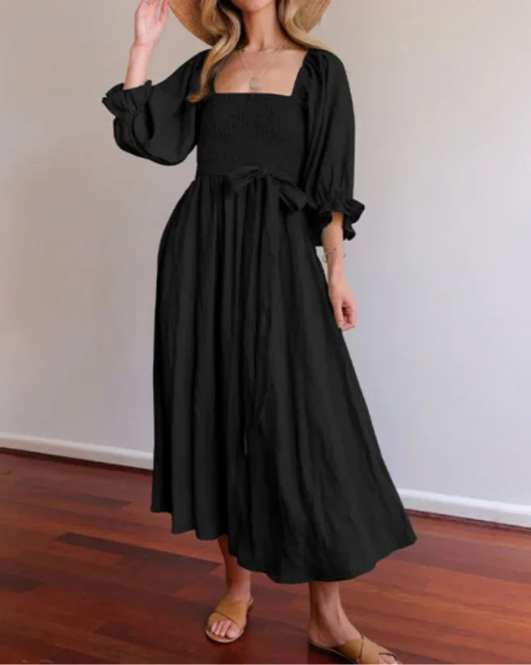 Robe midi portefeuille avec manches longues, col V en tissu fluide, idéale pour un look elegant et confortable au quotidien.