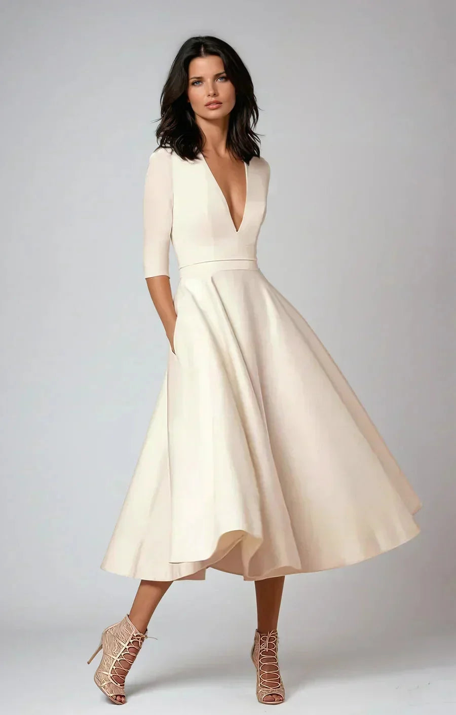 Robe midi évasée en tissu lisse, col en V, manches 3/4 et poches, idéale pour les invités d'un mariage.