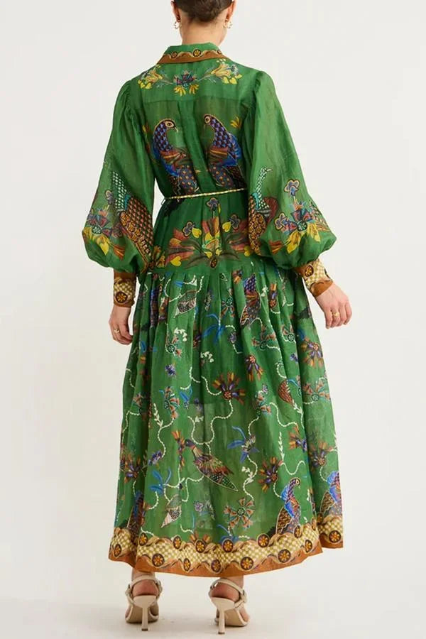Robe midi verte à imprimé oiseaux, manches longues, col chemise, ceinture intégrée, parfaite pour l'automne.