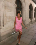 Robe courte sans manches en tissu léger avec franges scintillantes, parfaite pour danser avec mouvement fluide lors des…