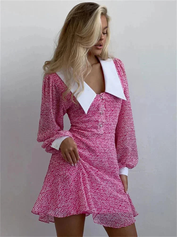 Robe courte rose à manches bouffantes avec col blanc, en tissu léger imprimé, idéale pour des sorties quotidiennes ou soirées.